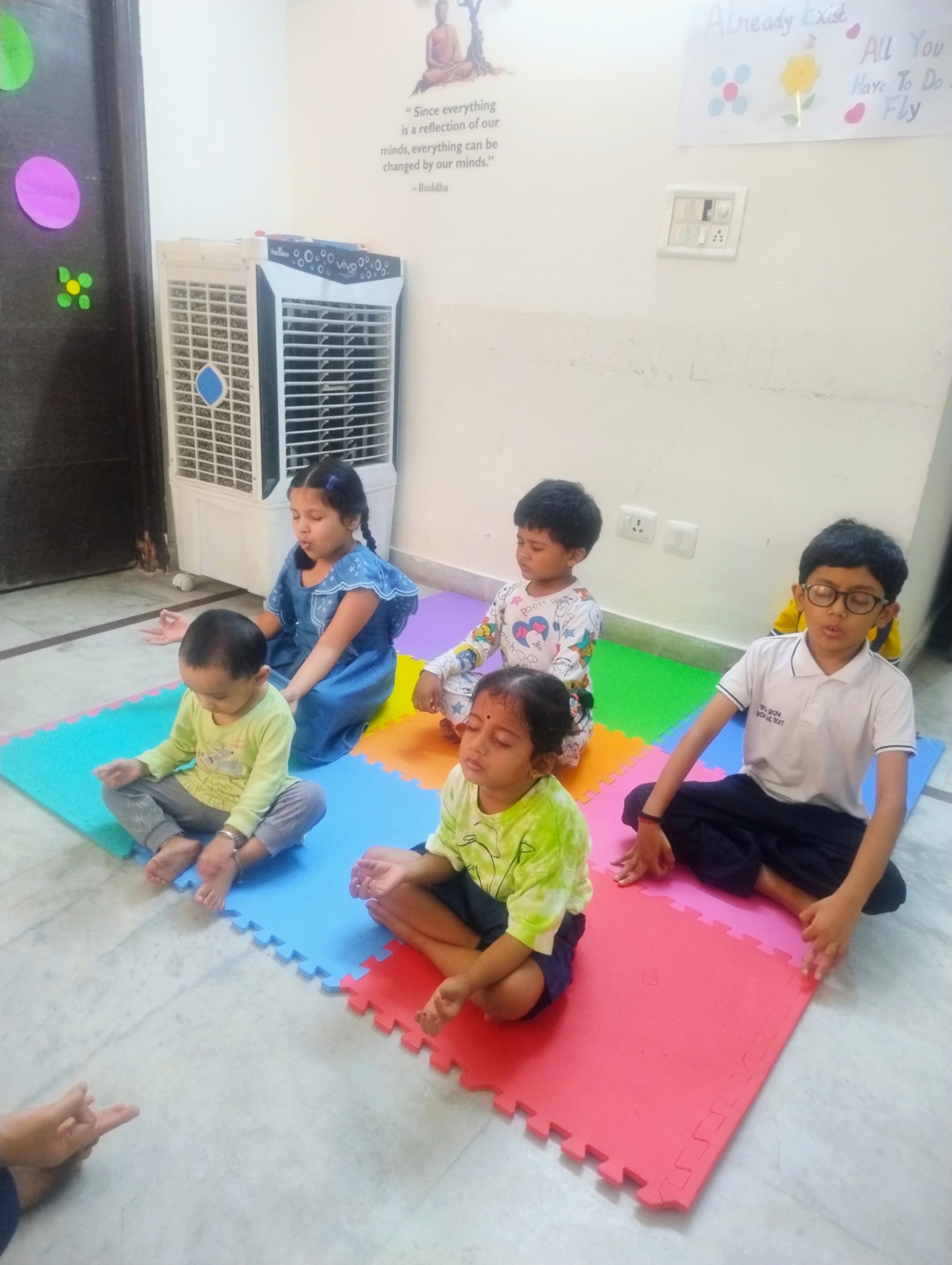 Three children engaged in a learning activity